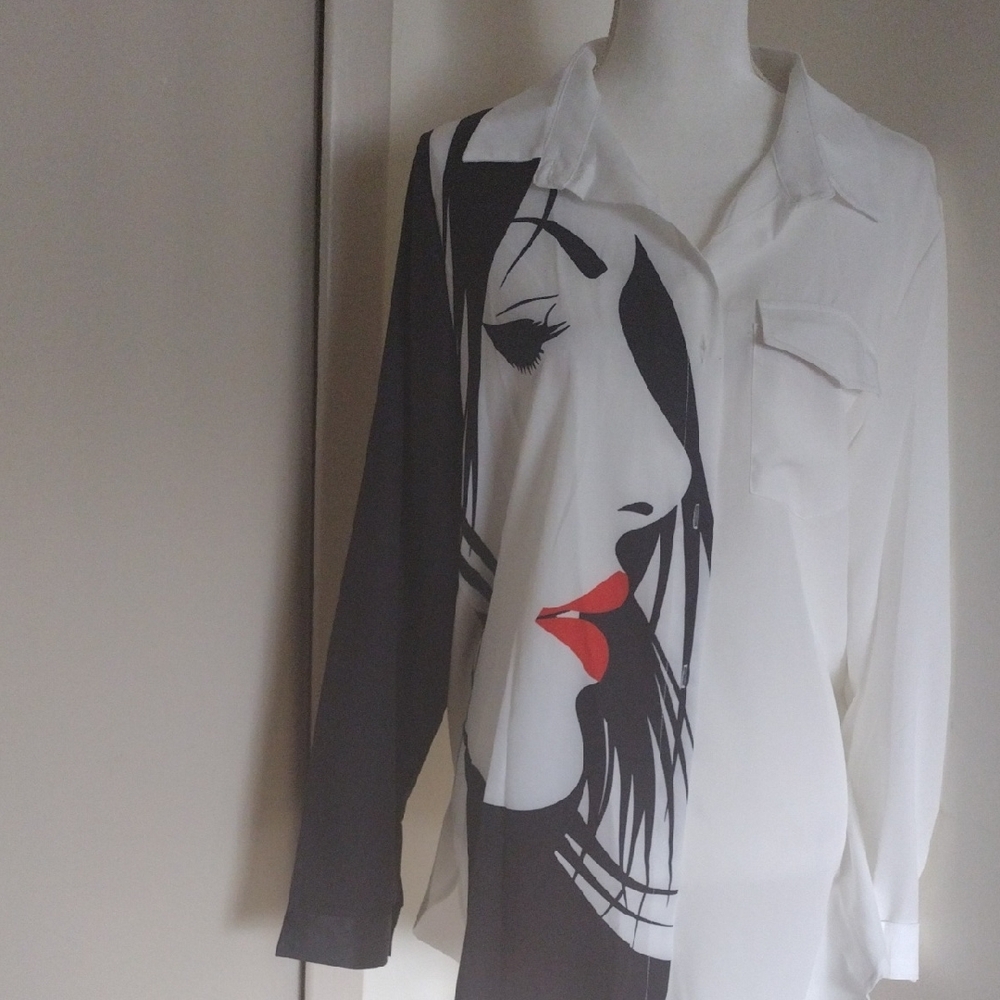 Artistic Black and White Blouse with Red Accent